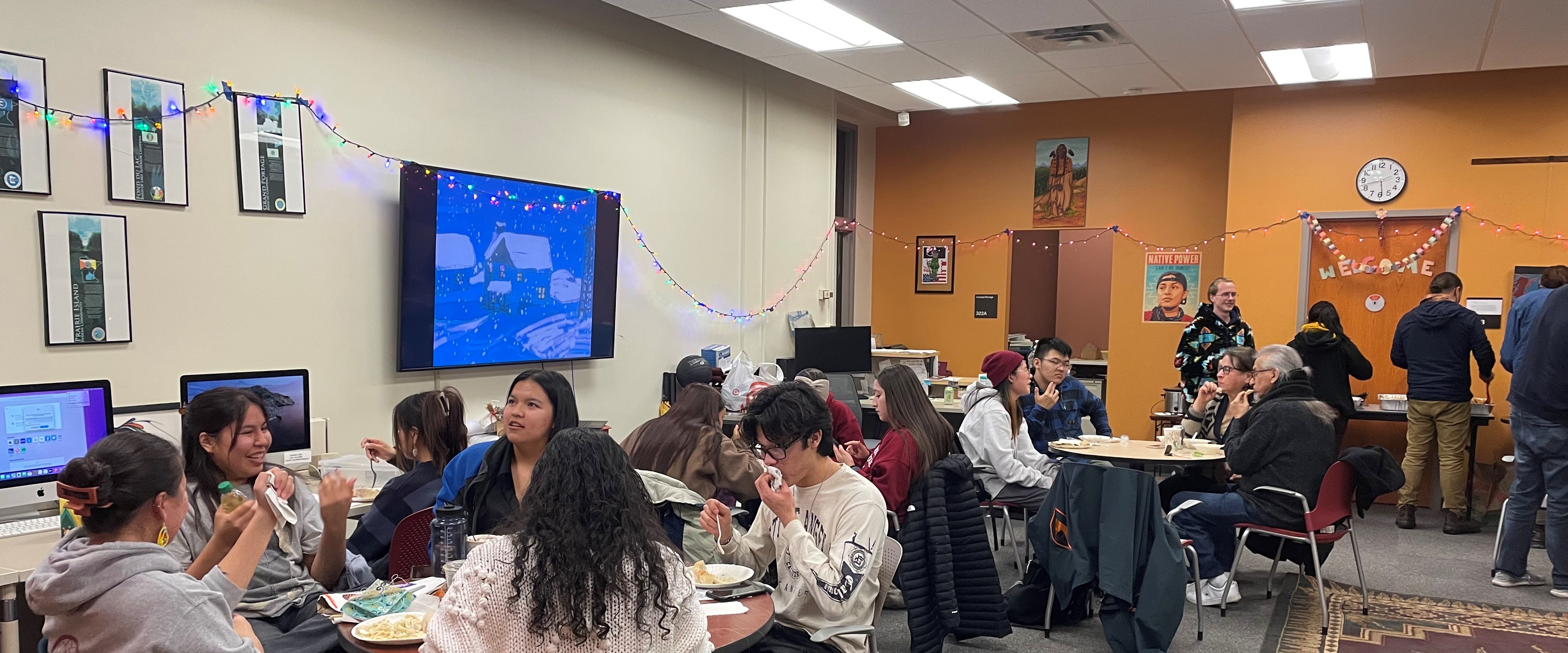 Students and community members gather at the COIN student space during a Winter Community social/gathering event (Winter 2022)